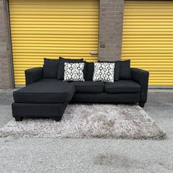 Charcoal grey sectional couch with reversible chaise