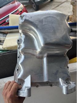 The part in the image is an engine oil pan, specifically the Dorman 264-485.According to the part's specifications and cross-references, it is a direc