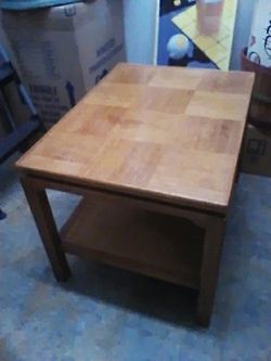 Blonde occasional table 21 in by 28 in and 20 in tall