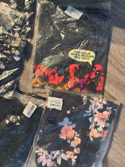 Brand new clothes in plastic with tags