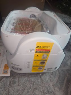 Automatic cat litter box, self-cleaning litter box with an easy-access step for cats weighing 3 to 18 pounds, includes a waste bin.