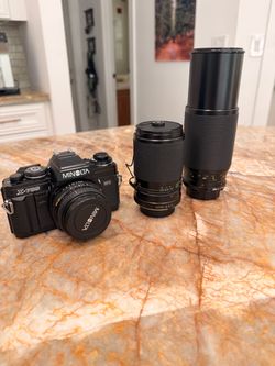 Minolta x700 with 3 lenses.