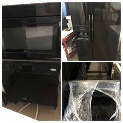 Side by side black kitchen appliance set
