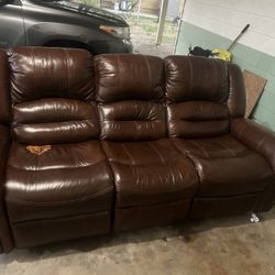 brown leather dual reclining sofa with nailhead trim. 