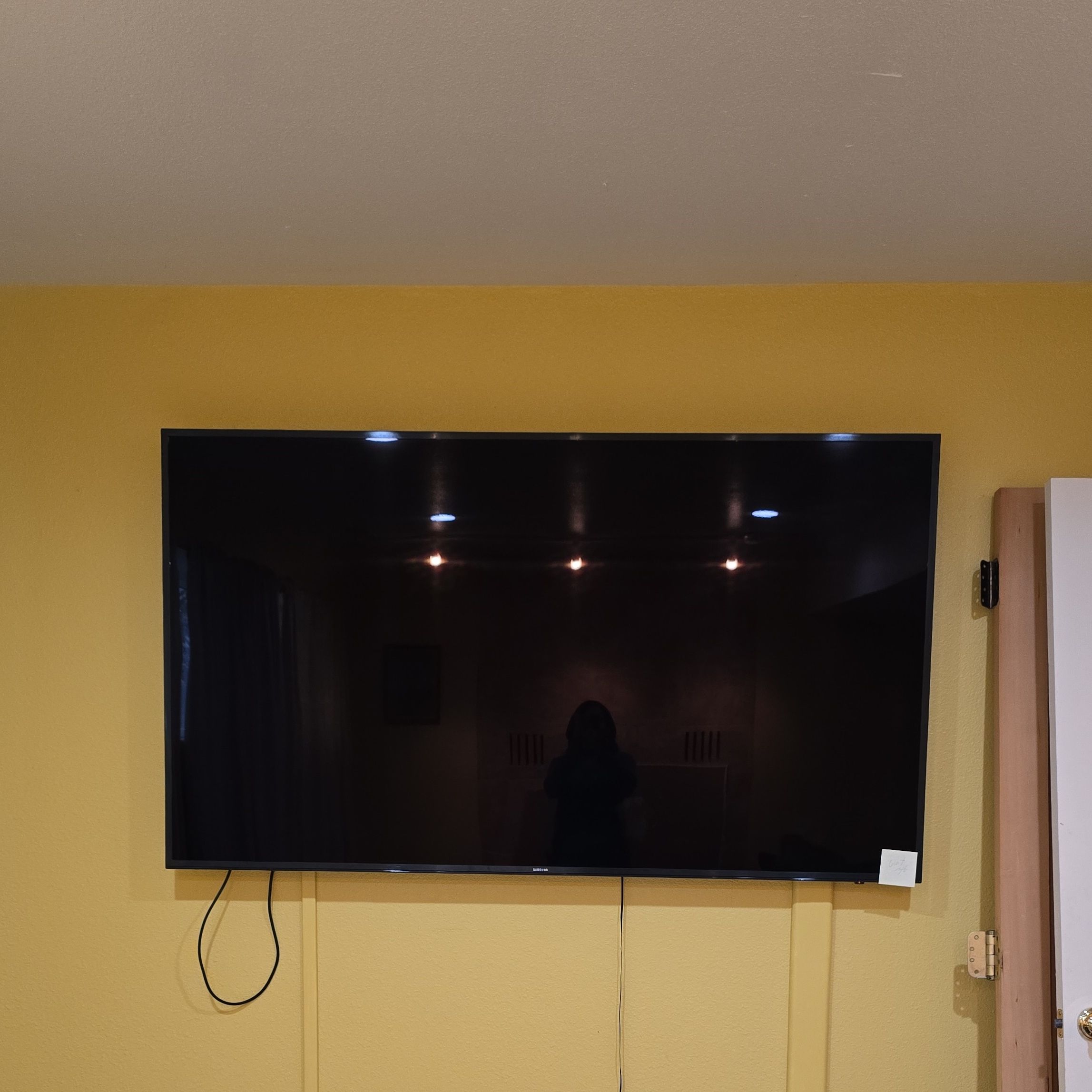 Wall Mounted Black Flat Screen TV 75"