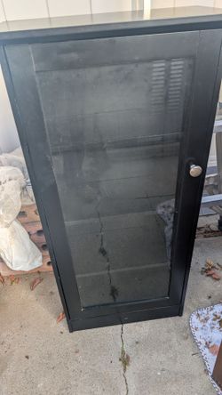 Black cabinet with glass shelves