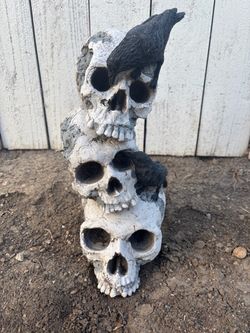 Stacked Skull Tower with Ravens Statue