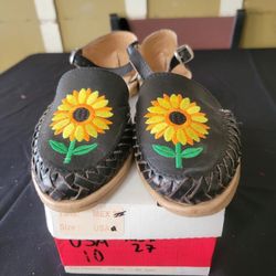 handmade black leather Mexican huarache sandals with yellow and orange sunflower embroidery