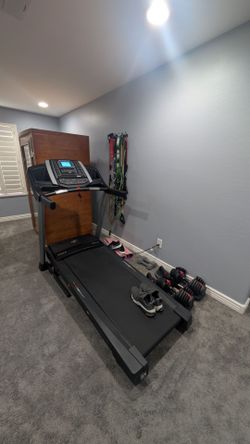 Home gym with Norditrack T series treadmill