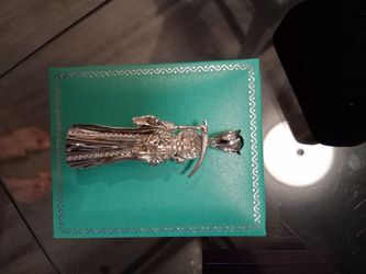 Santa muerte pendant with baguette diamonds
