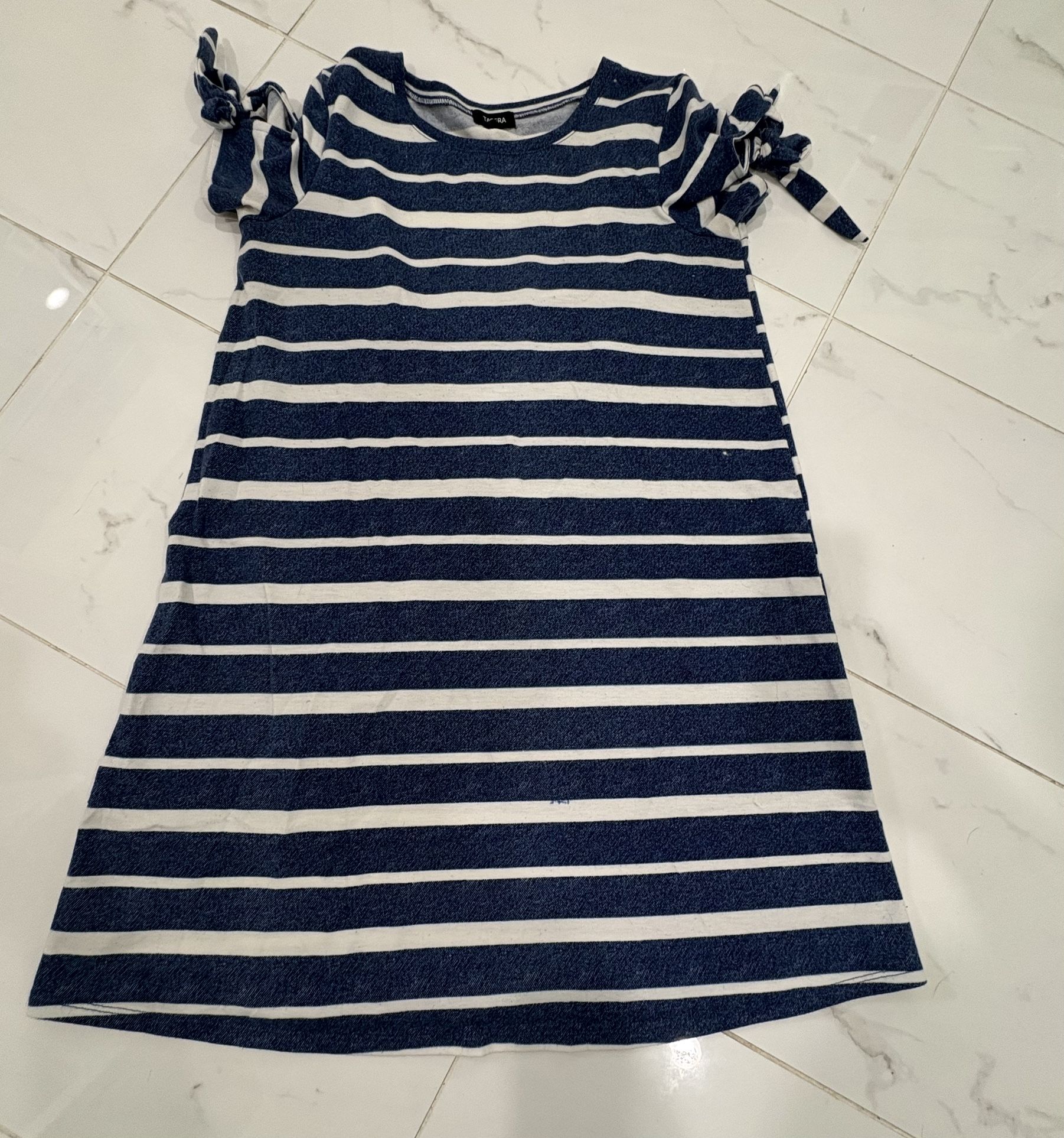 Stylish women dress with navy and white stripes.