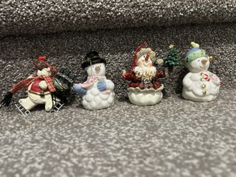 4 Christmas Ornaments Approx 3 1/2” Tall. One of them is a 2000 Coca -Cola Ornament. 