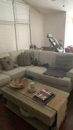L shaped sofa besiege with six pillows, gently used