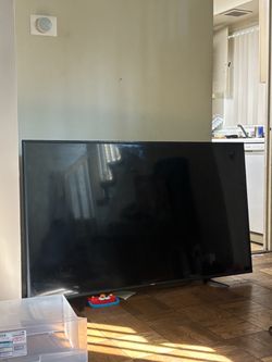 65” TV and Roku plug in