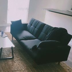 black couch mid century modern futon