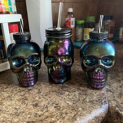 3 Chrome Skull cups the one in the middle is glass the other two plastic $4 for all 3