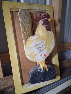 Wood carved rooster in frame,