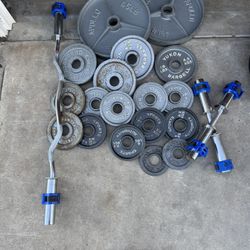 Olympic weights 185lbs total plus curl bar and adjustable dumbbells