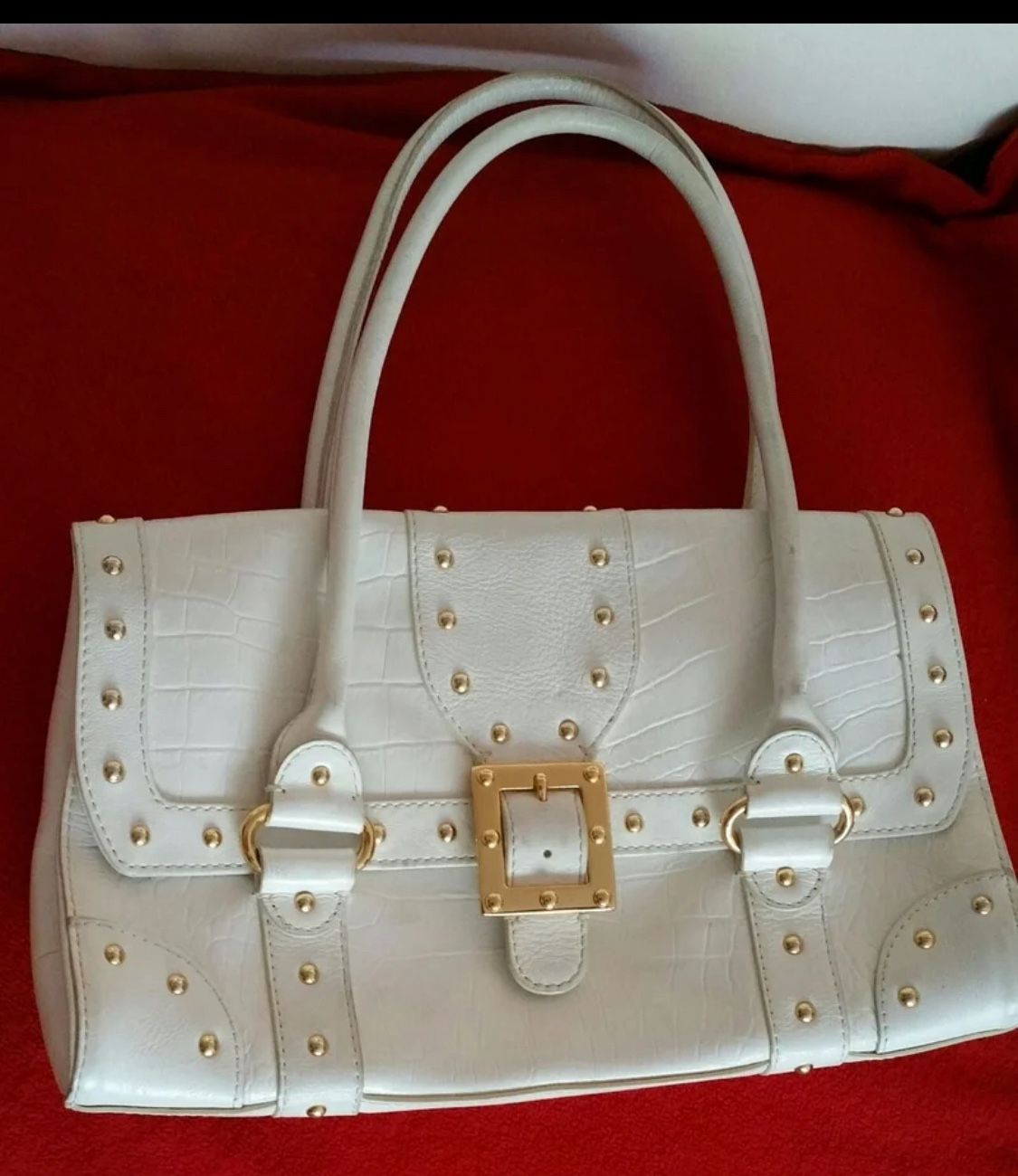 Michael Michael Kors Rare! Purchased Saks Fifth Avenue. Features gold toned studs and faux buckle on Four interior slip pockets and two zippered po