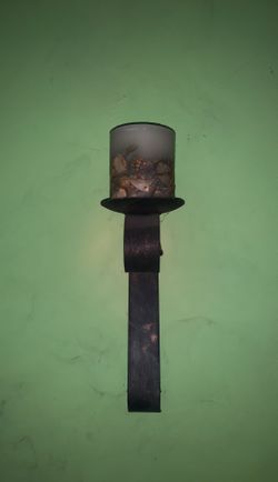 Rustic, metal candle holder for the wall