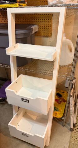 Angled white shelving unit.