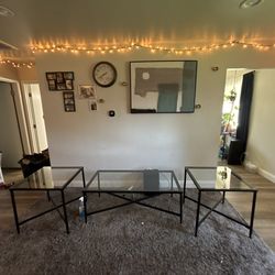 Ashley Laney 3-Piece Glass & Black Metal Coffee Table Set