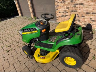 John Deere E100 42” deck riding lawn mower (only 143 hours)