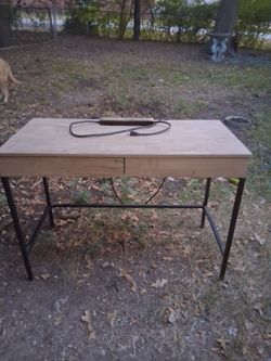 Cool two drawer desk with built in outlets and USB ports.