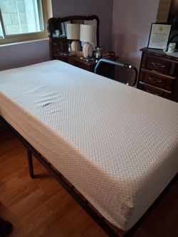 Twin bed with safety bar