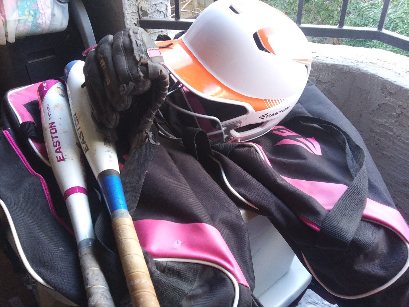 Girls softball bat, bag, left hand glove, helmet