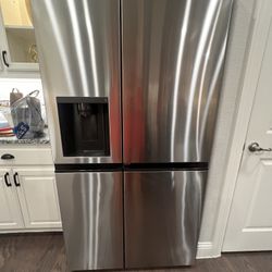 LG Stainless Steel Side-by-Side Refrigerator – 27 Cu. Ft. $600