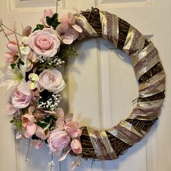 Pink wreath for front door. New. 22” comes from a smoke free environment. Shops in its own box.