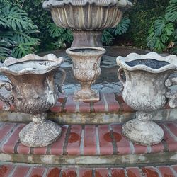 3 Greek looking earn fiberglass rustic flower pots