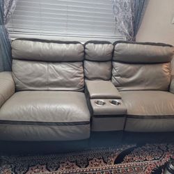 Seven seat leather sofa, six recliner and have charger space in the side with two small storage with