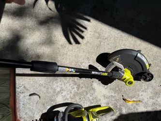 RYOBI cordless edger, plus extra wire reels, battery not included