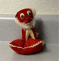 Vintage Red Plush Toy On Pillow
