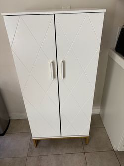 White Two-Door Storage Cabinet with Gold Legs