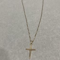 14k Gold necklace with a cross