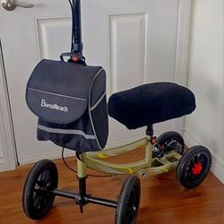 BLESS REACH BRAND KNEE SCOOTER/WALKER. ALL TERRAIN!  FOLDABLE. ADJUSTABLE. PEARL GOLD FRAME. DUAL BRAKES. BAG, SERPA COVER/PAD. EXCELLENT CONDITION!
