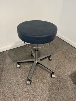 Blue vinyl rolling stool on wheels 16w18h adjustable height 18”-24”