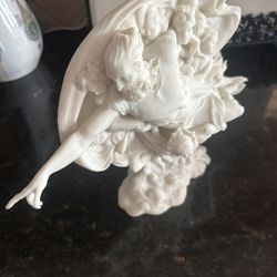 figurine is adapted from the Creation of Adam (also commonly called the Creation of Man), a fresco painted by Michelangelo circa 1511 that appears on 