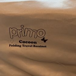 Primo Travel folding bassinet with carrying bag