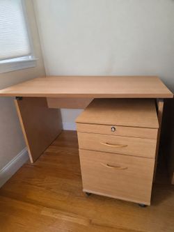 Light wood office furniture set. Desk filling cabinet and hutch