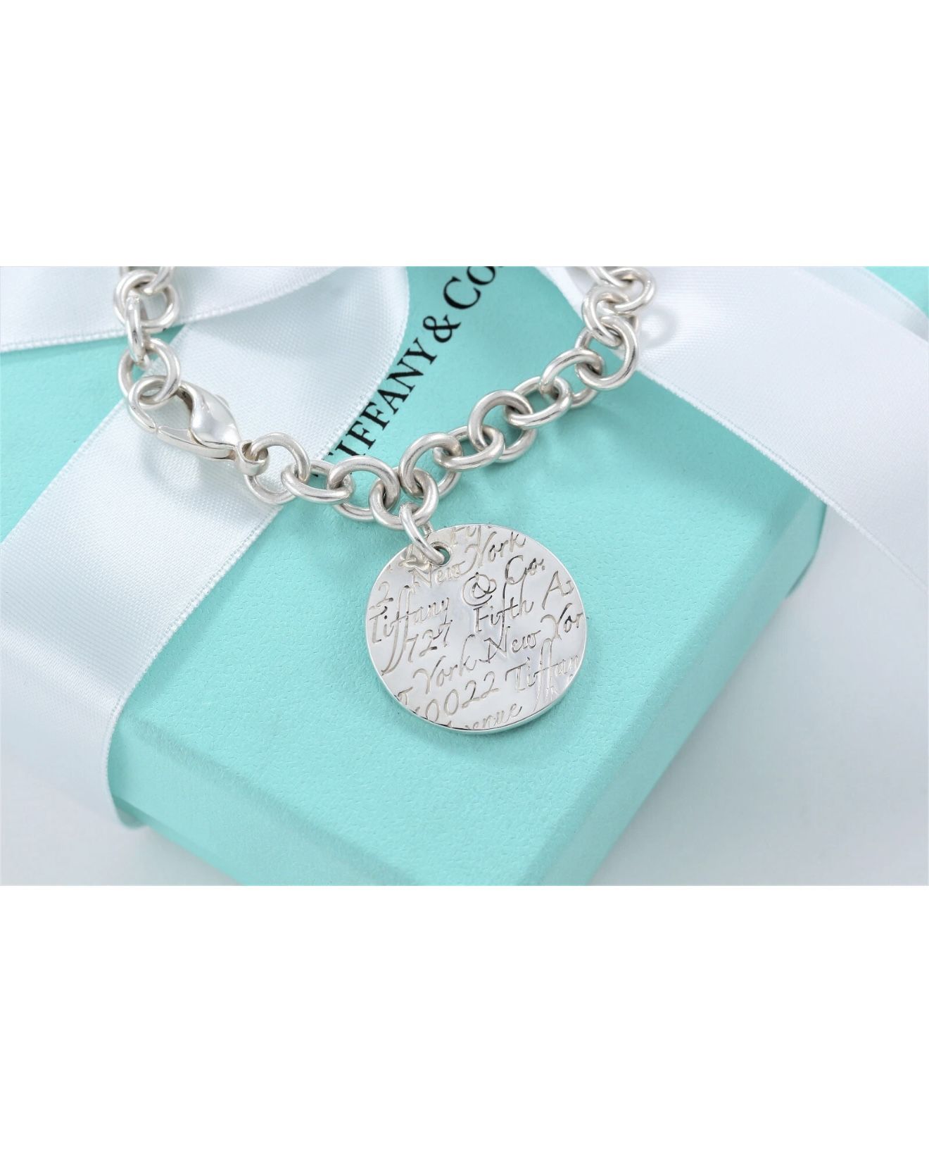 TIFFANY & CO. Sterling Silver New York Stamped Wavy Tag Charm Bracelet 