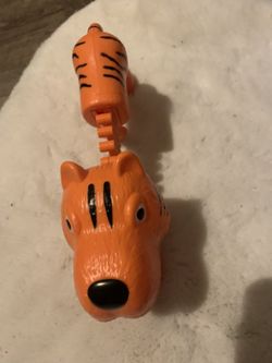Orange tiger toy, and Blue shark toy