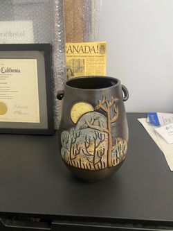 Dark Ceramic Vase with Sun and Tree Relief Design
