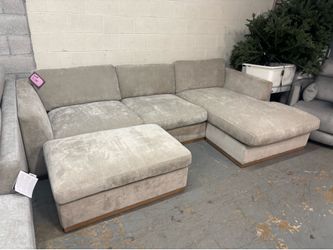 Beige L-shaped sectional. Reversible.