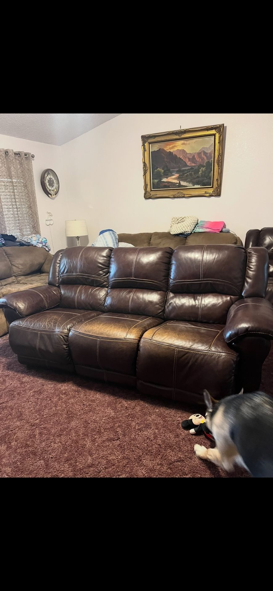 Brown leather reclining sofa and love seat set