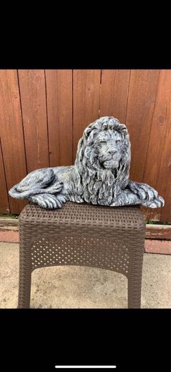 Stone colored lion statue