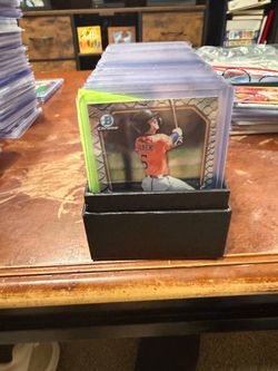 whole stack of baseball and football  cards